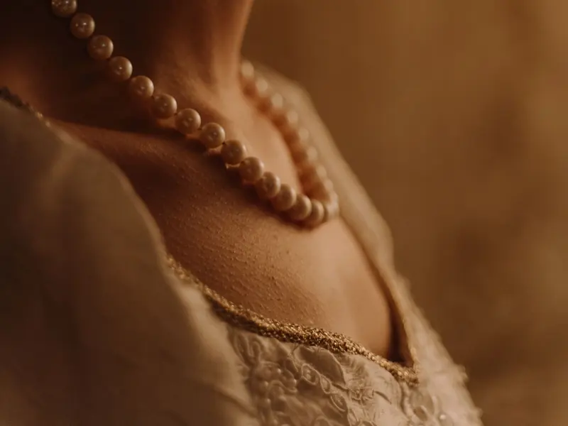 Stock photograph: a woman wearing pearl jewellery